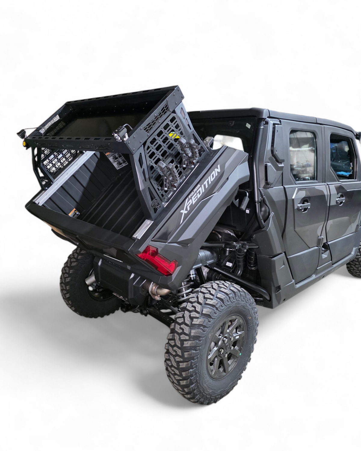 Polaris Xpedition Volt bed rack shown loaded with fuel cans and recovery gear