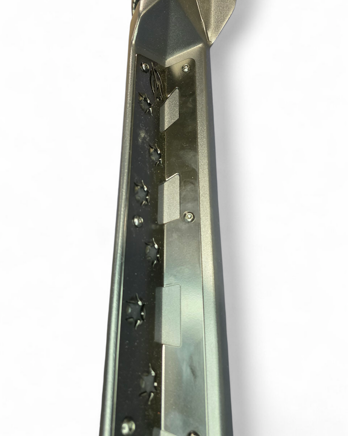 Aluminum accent plate and steel slider junction on Polaris Xpedition rock steps