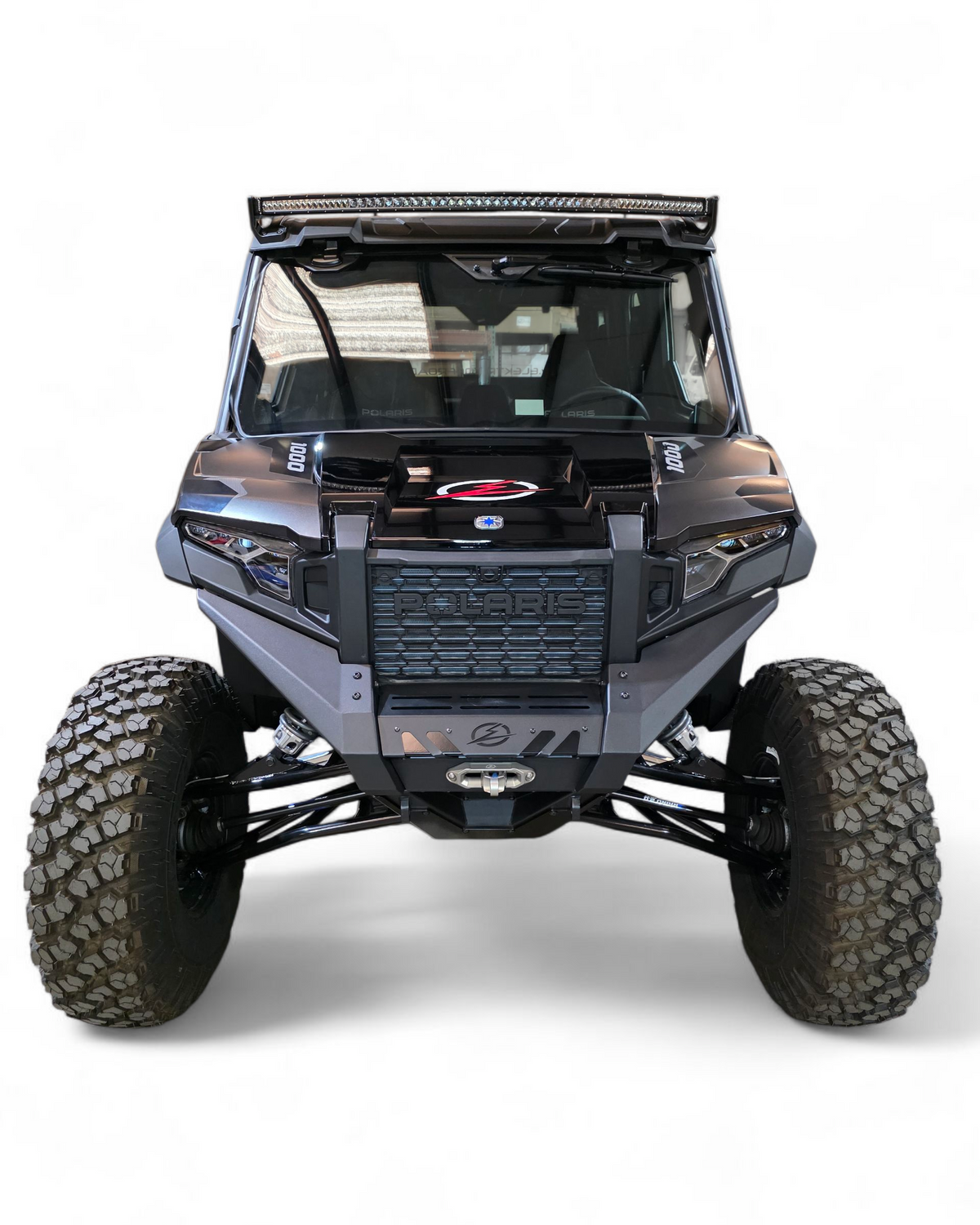 Full machine front view of Polaris Xpedition fitted with HDX Front Winch Bumper and aggressive stance