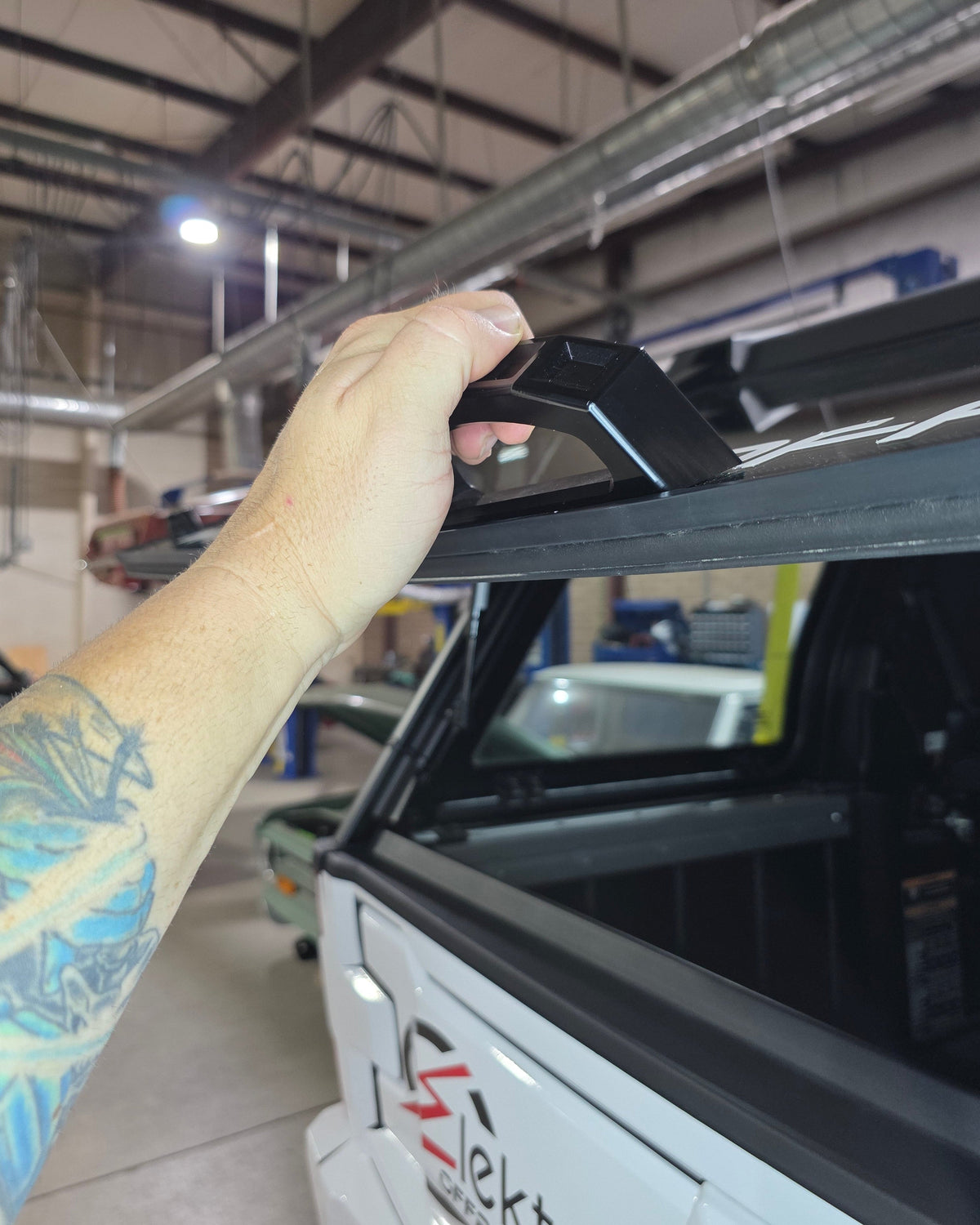 Adhesive-mount rear glass handle shown clean and flush on Polaris Xpedition