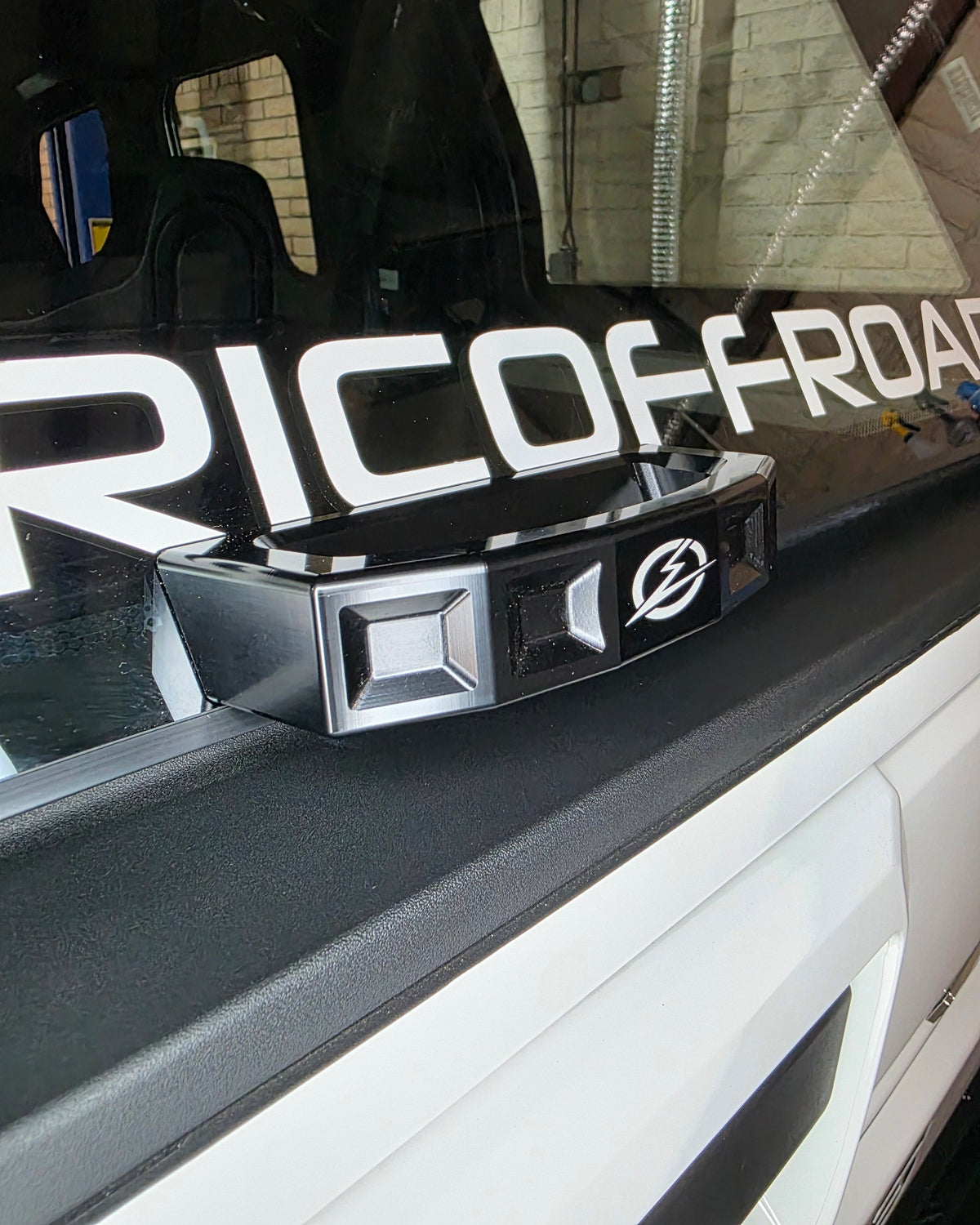 Polaris Xpedition rear glass handle shown in use reaching the rear of the machine