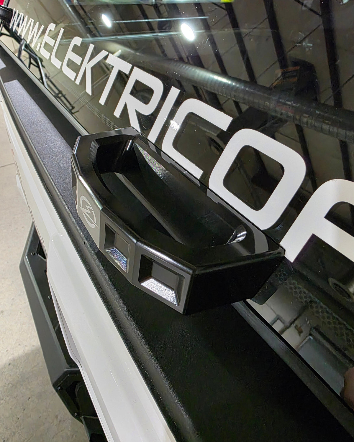 Close-up of anodized black billet finish on Polaris Xpedition rear glass handle