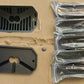 Two black billet casings and a set of 8 packaged casings for the rock light case.