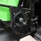 Black audio speaker mounted on a green vehicle door frame