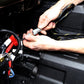 Hands connecting UTV Stereo wiring harness in vehicle engine bay