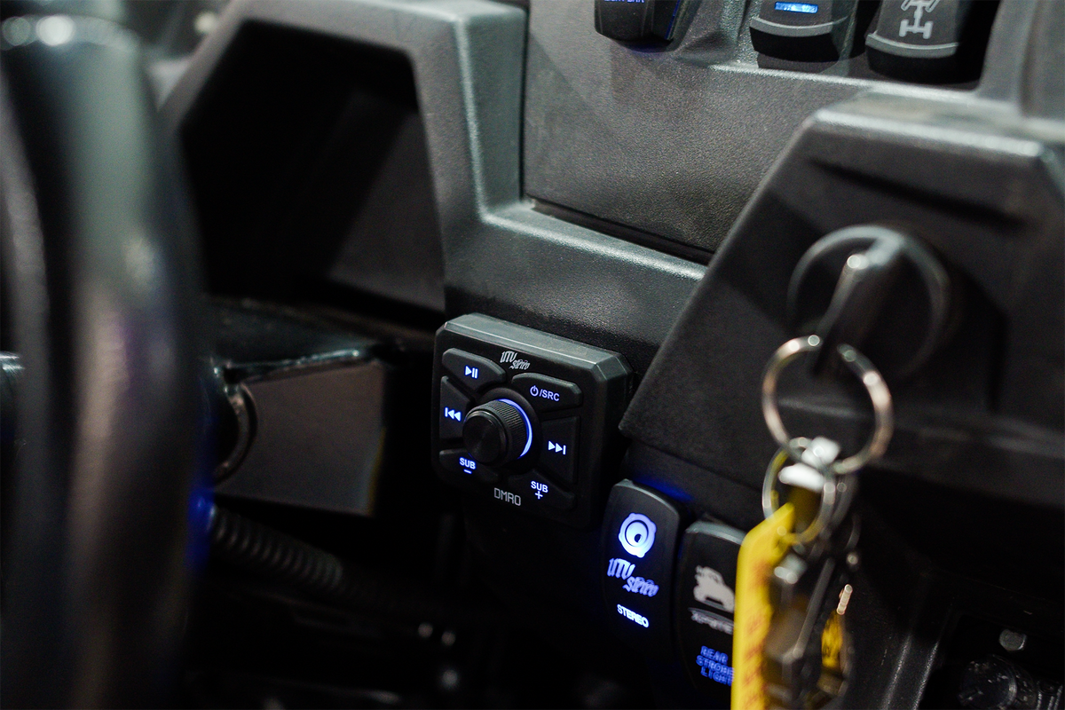 UTV Stereo DMRO media controller mounted on a vehicle dashboard