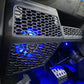 UTV Stereo speaker pod with blue LED lighting installed in vehicle dashboard
