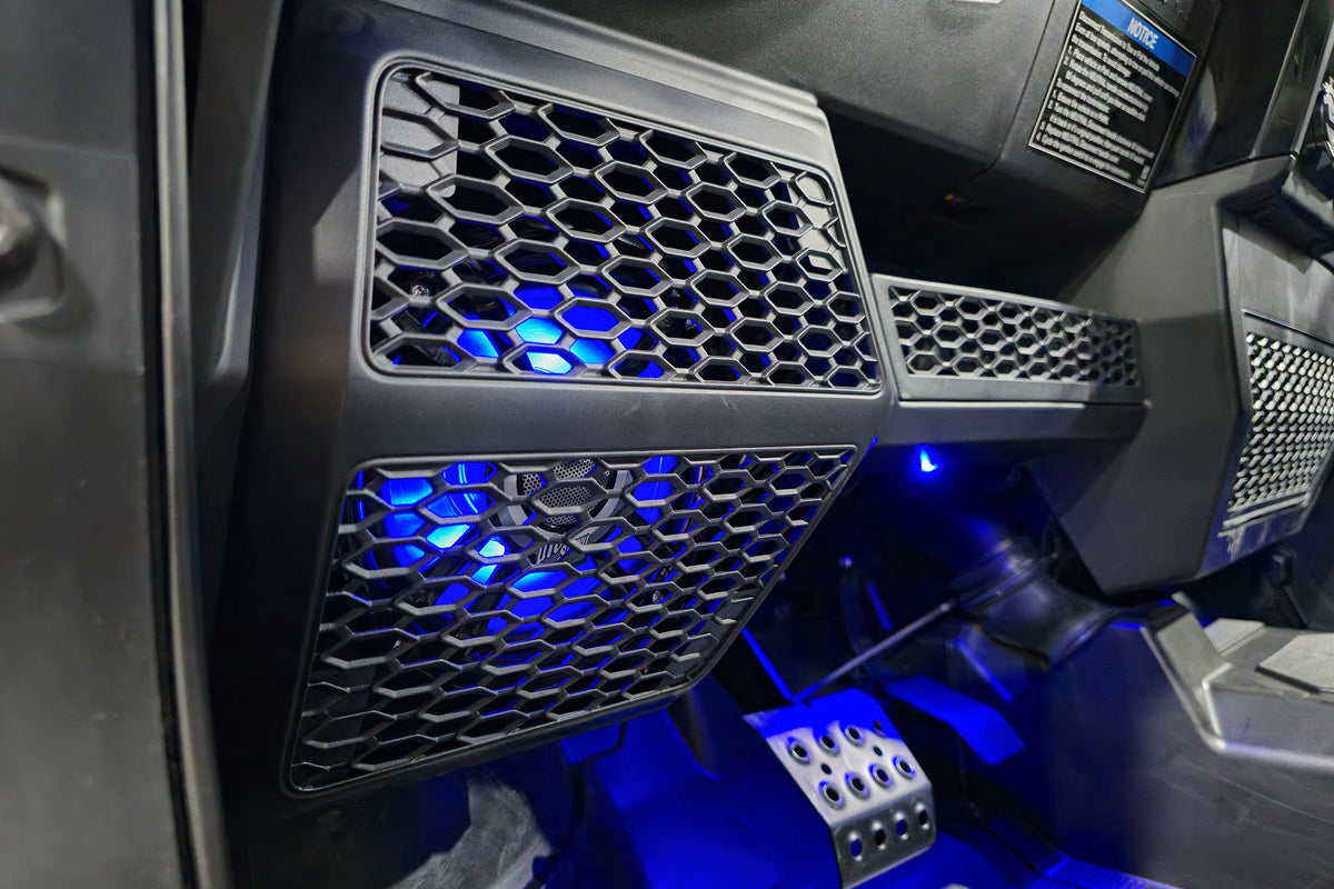 UTV Stereo speaker pod with blue LED lighting installed in vehicle dashboard