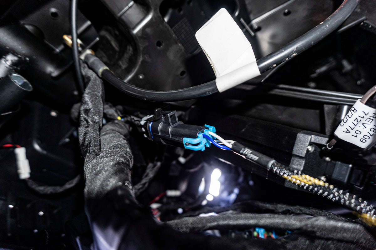 Automotive wiring harness with black and blue plastic connector