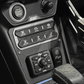 Vehicle center console with engine start stop button drive mode switches and UTV Stereo audio controls