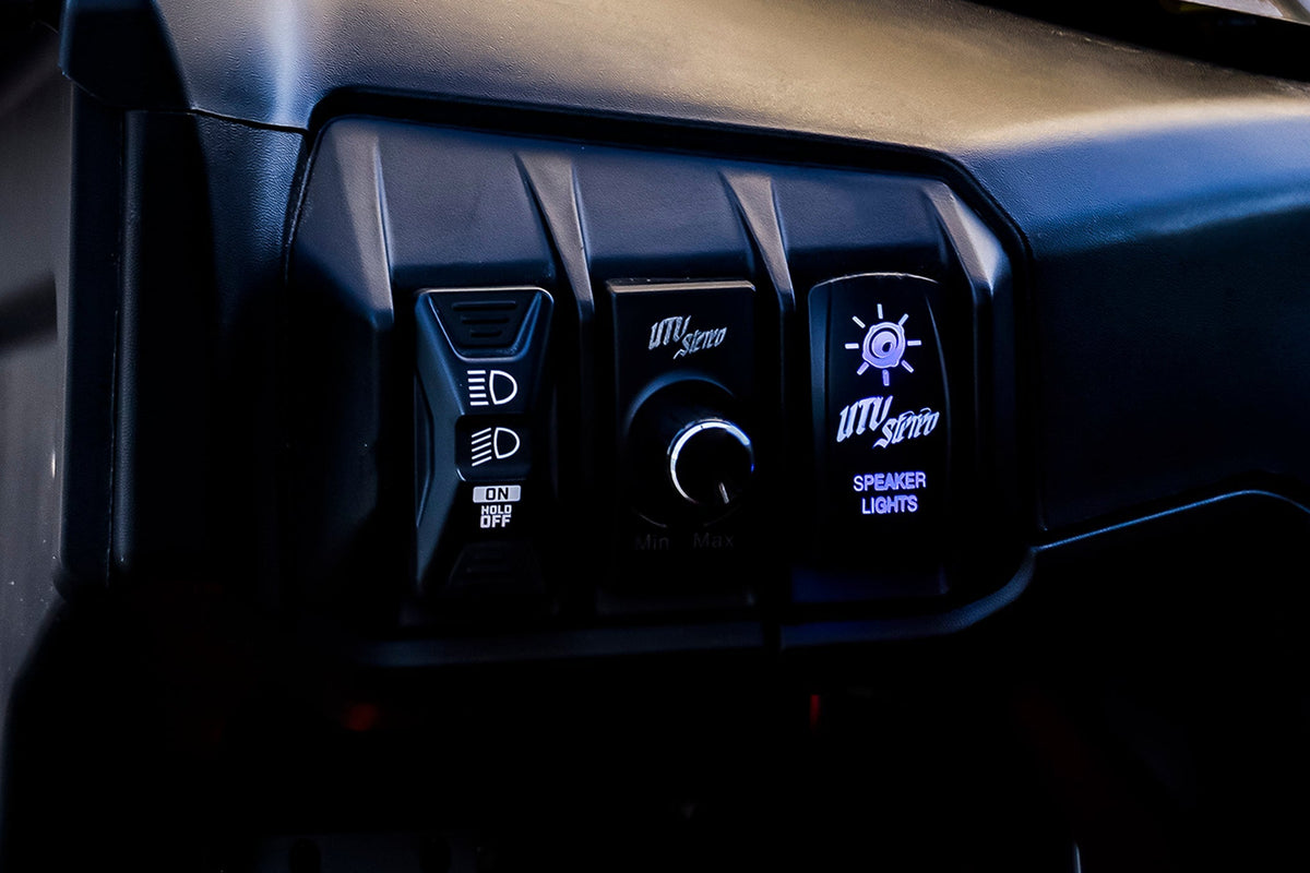 UTV Stereo control panel with headlight switch volume knob and illuminated speaker lights switch