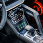Interior center console of a vehicle with illuminated switch panel and gear shifter