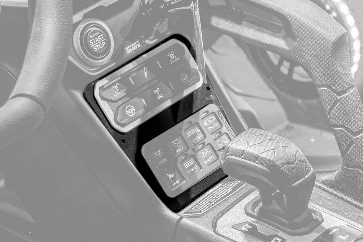 Vehicle dashboard with engine start button and touch screen control panel for lights and accessories