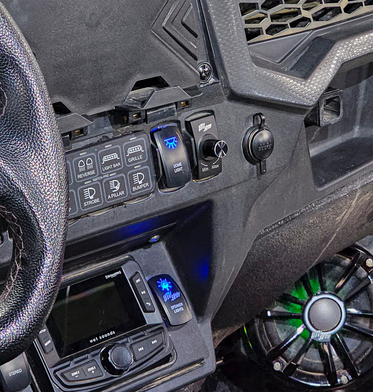 UTV Pro dashboard switch panel with illuminated dome light and speaker light controls