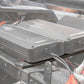 Two MB Quart digital amplifiers mounted in a vehicle chassis with input cables connected