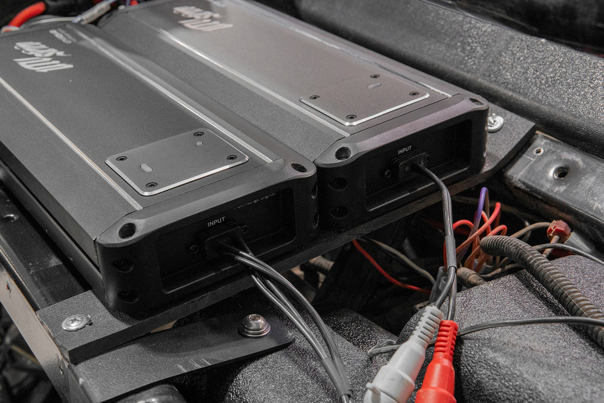 Two UTV Stereo amplifiers mounted with input cables connected