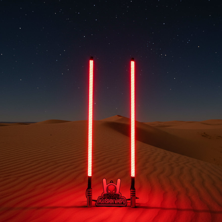 Two illuminated LED lightsabers with the dunes background and a Marshin Whips product logo below.