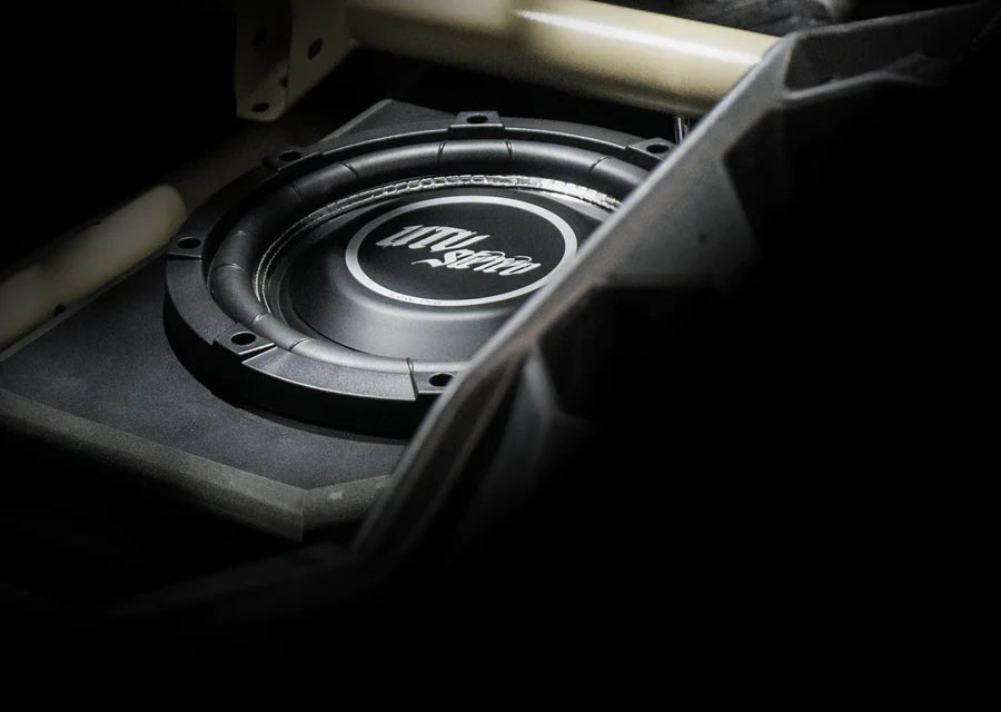UTV Stereo subwoofer mounted in a vehicle enclosure