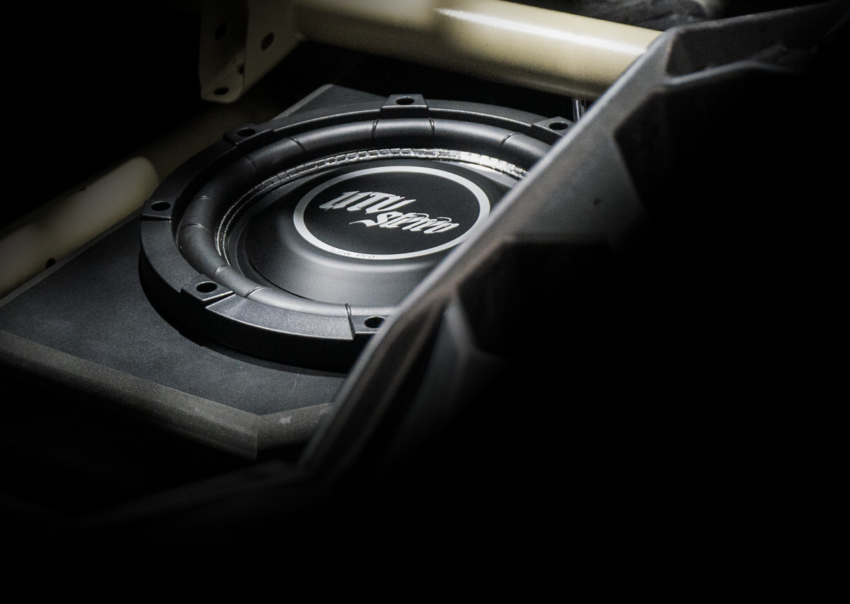 UTV Stereo subwoofer mounted in a vehicle enclosure