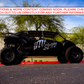 Black UTV Stereo branded off road vehicle parked in a lot