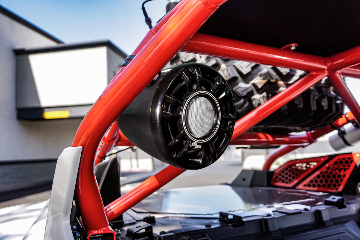 MTX Audio wake tower speaker mounted on a red roll cage of an off road vehicle
