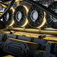 Four circular MTX Audio speakers with glowing yellow LED rings mounted on a roll cage