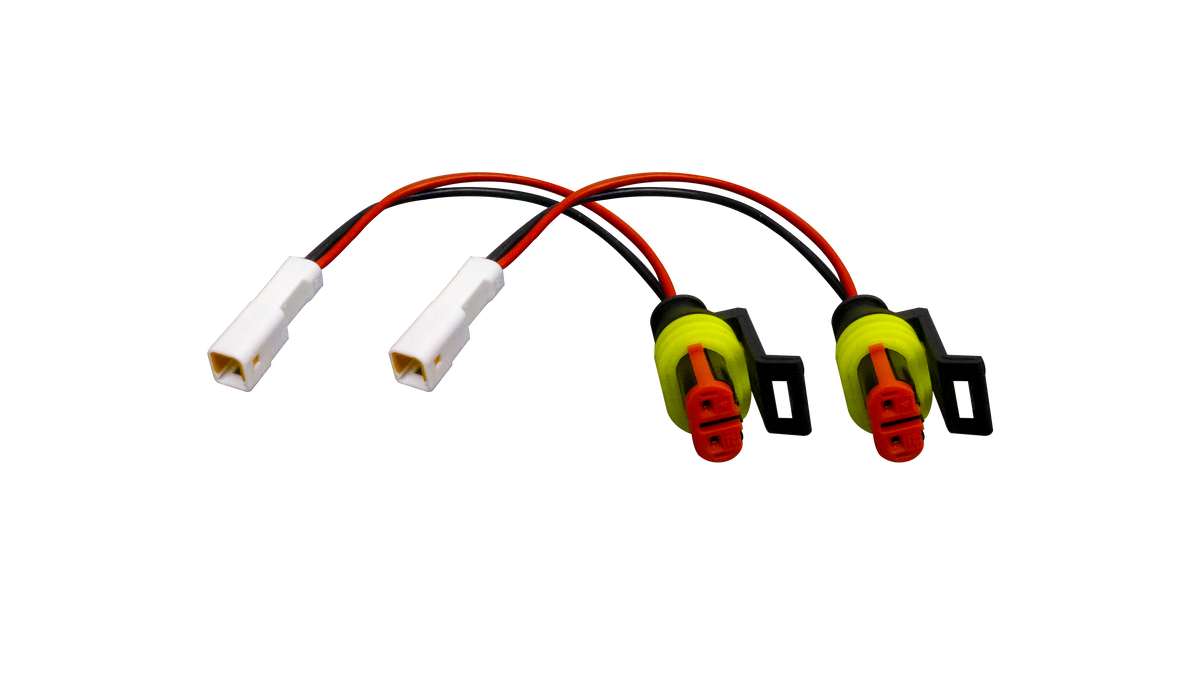 Two electrical wire harness adapters with white connectors and sealed red and yellow plugs