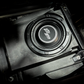 UTV Stereo subwoofer installed in a black plastic enclosure