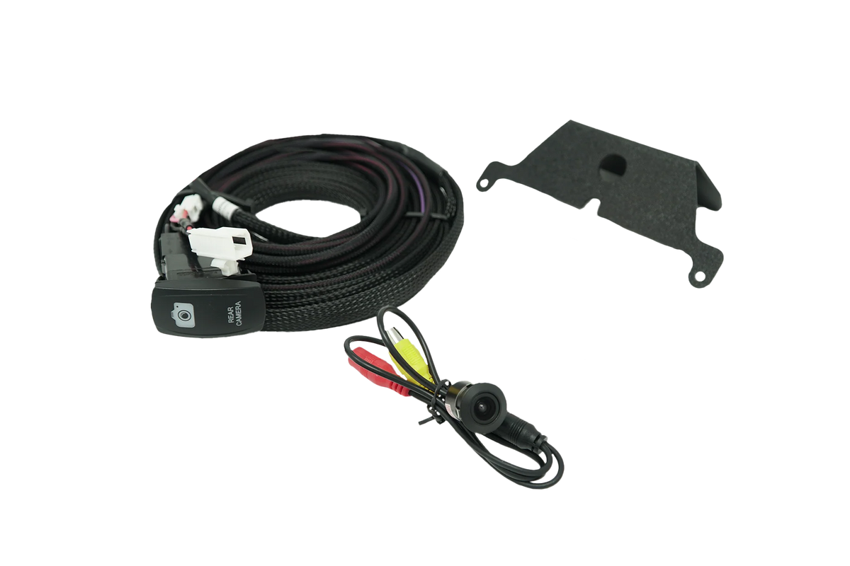 Rear camera kit with wiring harness, mounting bracket, and camera lens